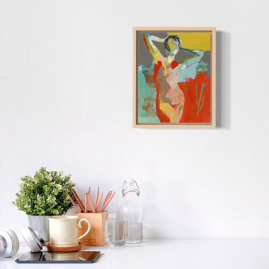 Colorful abstract painting of a woman on a wall above a desk with office supplies.