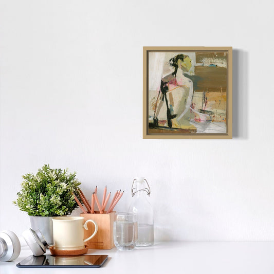 Framed artwork on a white wall with decorative items below